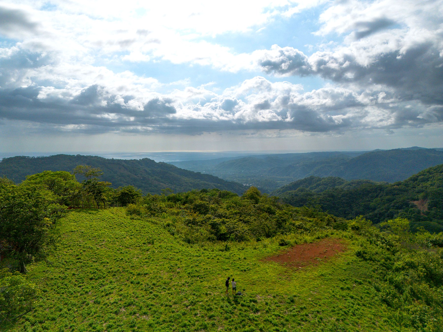 Finca 1 — people on the land with ocean view